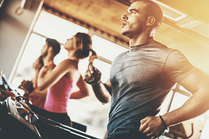 Sweating man running on treadmill